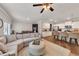 Bright living room open to the kitchen and dining area, perfect for entertaining at 738 Woodstock Grove Dr, Woodstock, GA 30188