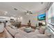 Spacious living room open to the kitchen with a fireplace and lots of seating at 738 Woodstock Grove Dr, Woodstock, GA 30188