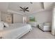 Spacious main bedroom with a ceiling fan and a sitting area at 738 Woodstock Grove Dr, Woodstock, GA 30188