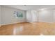 Bright living room with hardwood floors and a large window at 1504 Wingate Way, Atlanta, GA 30350