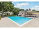 Enjoy the community pool with a lounge area for relaxation in a serene and landscaped setting at 1504 Wingate Way, Atlanta, GA 30350