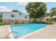Sparkling community pool surrounded by lush landscaping, perfect for a refreshing swim and relaxation at 1504 Wingate Way, Atlanta, GA 30350