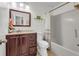 Traditional bathroom with wood vanity, single sink, tiled floor, and shower-tub combination at 191 Baywood Way, Hiram, GA 30141