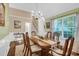 Elegant dining room featuring a hardwood floor, wainscoting, and a classic chandelier at 191 Baywood Way, Hiram, GA 30141