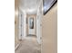 A neutral hallway with carpet flooring and white doors, offering a clean and simple aesthetic at 191 Baywood Way, Hiram, GA 30141