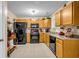 Well-lit kitchen featuring stainless steel appliances, granite countertops, and ample cabinet space at 191 Baywood Way, Hiram, GA 30141