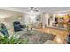 Bright living room with hardwood floors, open access to the kitchen and dining area, and a comfortable seating area at 191 Baywood Way, Hiram, GA 30141