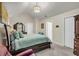 Comfortable main bedroom with vaulted ceiling, carpet flooring, and ensuite bathroom at 191 Baywood Way, Hiram, GA 30141