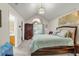 Spacious main bedroom with vaulted ceiling, large window, and ensuite bathroom at 191 Baywood Way, Hiram, GA 30141