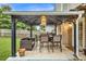 Covered patio featuring a dining table with chairs and an outdoor seating area at 191 Baywood Way, Hiram, GA 30141