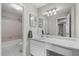 Bathroom featuring a long vanity and shower/tub combo at 1910 Countryside Se Pl, Smyrna, GA 30080