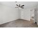 Neutral bedroom featuring a ceiling fan, ensuite bathroom, and neutral carpet at 1910 Countryside Se Pl, Smyrna, GA 30080