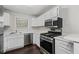 A newly renovated kitchen with white cabinets and stainless steel appliances at 1910 Countryside Se Pl, Smyrna, GA 30080