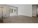 Spacious living room featuring lots of natural light and neutral-toned carpet at 1910 Countryside Se Pl, Smyrna, GA 30080