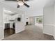 View of the living room and kitchen with white cabinets and stainless steel appliances at 1910 Countryside Se Pl, Smyrna, GA 30080