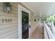 View of the porch showing the front door and the house numbers at 1910 Countryside Se Pl, Smyrna, GA 30080