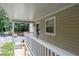 A covered porch with view of landscaped entrance at 1910 Countryside Se Pl, Smyrna, GA 30080