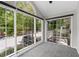 A sunroom with lots of sunlight due to the many windows and a sliding glass door at 1910 Countryside Se Pl, Smyrna, GA 30080