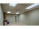 Basement area with a kitchenette and drop ceiling at 217 Bridgewater Trl, Canton, GA 30115