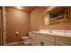 Neutral bathroom featuring a white vanity, mirror, and toilet for a simple and clean design at 217 Bridgewater Trl, Canton, GA 30115