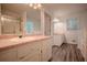 Bright bathroom featuring double vanity, modern fixtures, and separate shower at 217 Bridgewater Trl, Canton, GA 30115