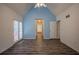 Spacious bedroom with a high ceiling, and doors leading to a balcony at 217 Bridgewater Trl, Canton, GA 30115