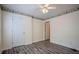Bedroom featuring stylish wood-look flooring and floral wallpaper border at 217 Bridgewater Trl, Canton, GA 30115