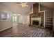 Spacious living room features a stone fireplace, vaulted ceilings, and new floors throughout at 217 Bridgewater Trl, Canton, GA 30115