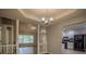 Inviting living space with views into the kitchen and dining area with modern lighting and wood flooring at 217 Bridgewater Trl, Canton, GA 30115