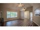 Bright living room featuring new flooring, large windows and open layout at 217 Bridgewater Trl, Canton, GA 30115