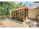 View of the wooden deck featuring a screened porch, accessible through glass doors at 217 Bridgewater Trl, Canton, GA 30115