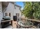 Cozy covered back deck featuring a table and chairs for outdoor dining at 6300 Blackwater Trl, Atlanta, GA 30328