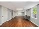 Finished basement with wood flooring, recessed lighting, and bright windows at 6300 Blackwater Trl, Atlanta, GA 30328