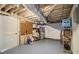 Unfinished basement space with exposed ceiling and ample storage at 6300 Blackwater Trl, Atlanta, GA 30328