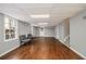 Finished basement with wood flooring, recessed lighting, and bright windows at 6300 Blackwater Trl, Atlanta, GA 30328