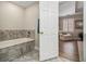 Well-maintained bathroom with tile flooring and bath plus natural light at 6300 Blackwater Trl, Atlanta, GA 30328