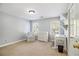 Bright, airy bedroom with neutral tones and ample natural light from two windows at 6300 Blackwater Trl, Atlanta, GA 30328