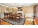 Elegant dining room with hardwood floors, decorative rug, and a classic chandelier at 6300 Blackwater Trl, Atlanta, GA 30328