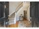 Inviting entryway with hardwood floors and a gracefully curved staircase at 6300 Blackwater Trl, Atlanta, GA 30328