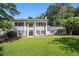 Classical home with a meticulously maintained lawn, surrounded by mature trees at 6300 Blackwater Trl, Atlanta, GA 30328