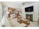 Comfortable living room with a fireplace, plenty of seating, and an open-concept kitchen at 6300 Blackwater Trl, Atlanta, GA 30328