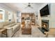 Cozy living room with fireplace and view into the kitchen at 6300 Blackwater Trl, Atlanta, GA 30328