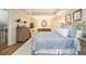 Comfortable main bedroom offering a tray ceiling, hardwood floors, and a relaxing sitting area at 6300 Blackwater Trl, Atlanta, GA 30328