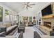 Inviting sunroom featuring a stone fireplace, vaulted ceilings, and comfortable seating at 6300 Blackwater Trl, Atlanta, GA 30328
