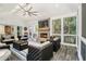 Inviting sunroom featuring a stone fireplace, vaulted ceilings, and comfortable seating at 6300 Blackwater Trl, Atlanta, GA 30328