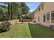 Large backyard with a basketball hoop and a wooden fence at 2761 Valley Spring Dr, Lawrenceville, GA 30044