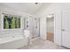 Bathroom features a soaking tub and a glass-enclosed shower at 2761 Valley Spring Dr, Lawrenceville, GA 30044