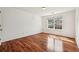 Bedroom features wood floors, neutral walls, and plenty of natural light at 2761 Valley Spring Dr, Lawrenceville, GA 30044