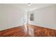 Empty bedroom featuring wood floors, ample natural light, and a neutral color scheme at 2761 Valley Spring Dr, Lawrenceville, GA 30044