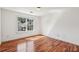 Bright bedroom features hardwood floors and a window with natural light at 2761 Valley Spring Dr, Lawrenceville, GA 30044